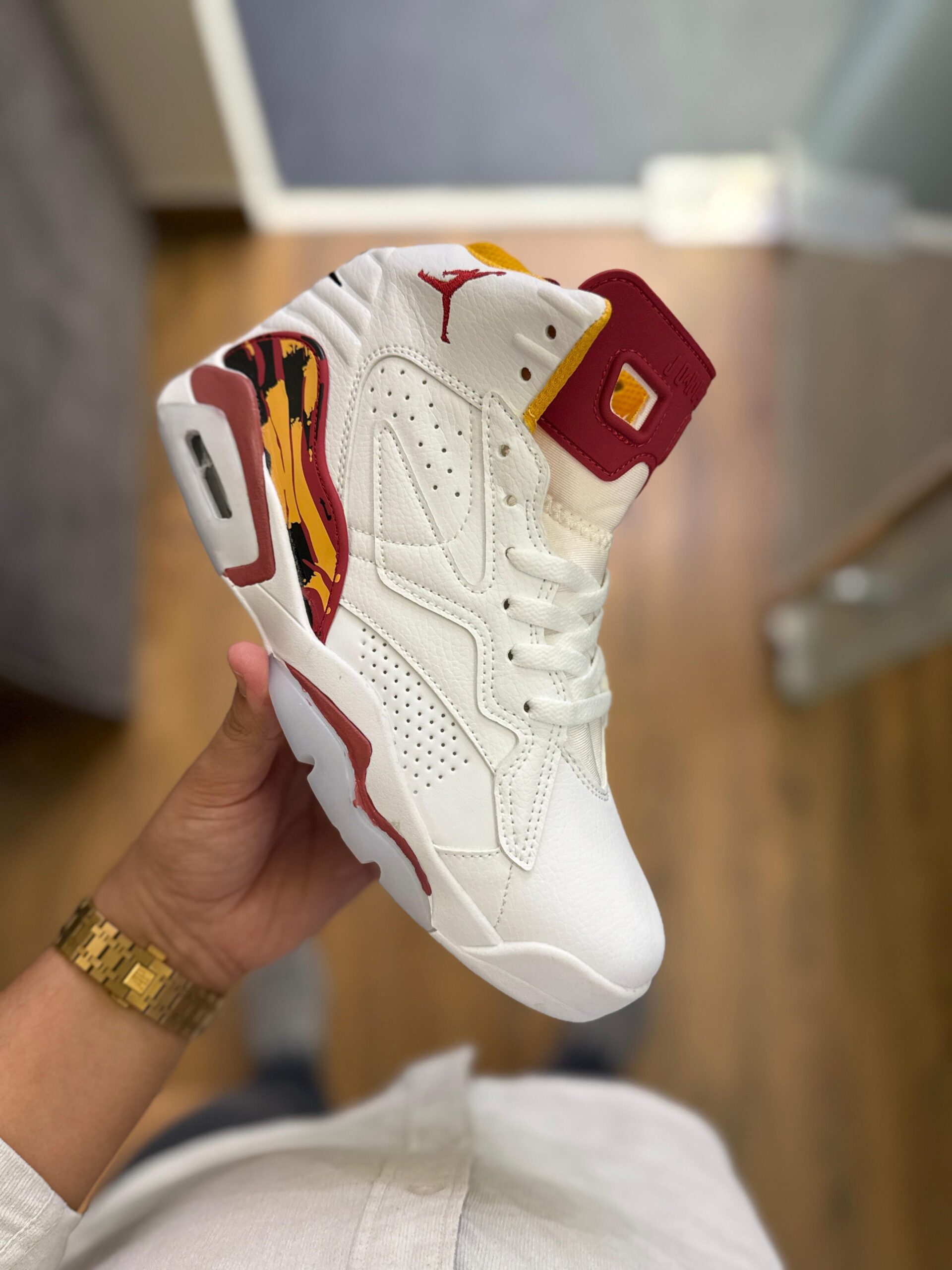 white and gold and red jordans